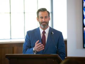 Mayor Josh Gates at podium
