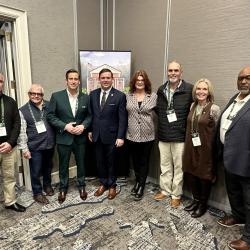 Councilmember Moody, Mayor Gates, Councilmember Smith, Councilmember Moore with state officials in meeting room