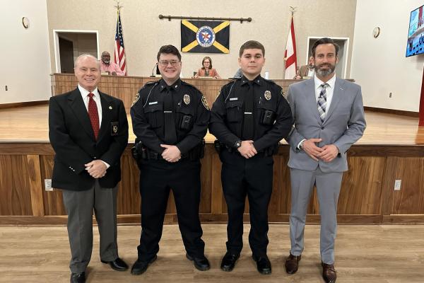 Police Chief Poe, Trevor Hudson, Steven Haynes, and Mayor Gates