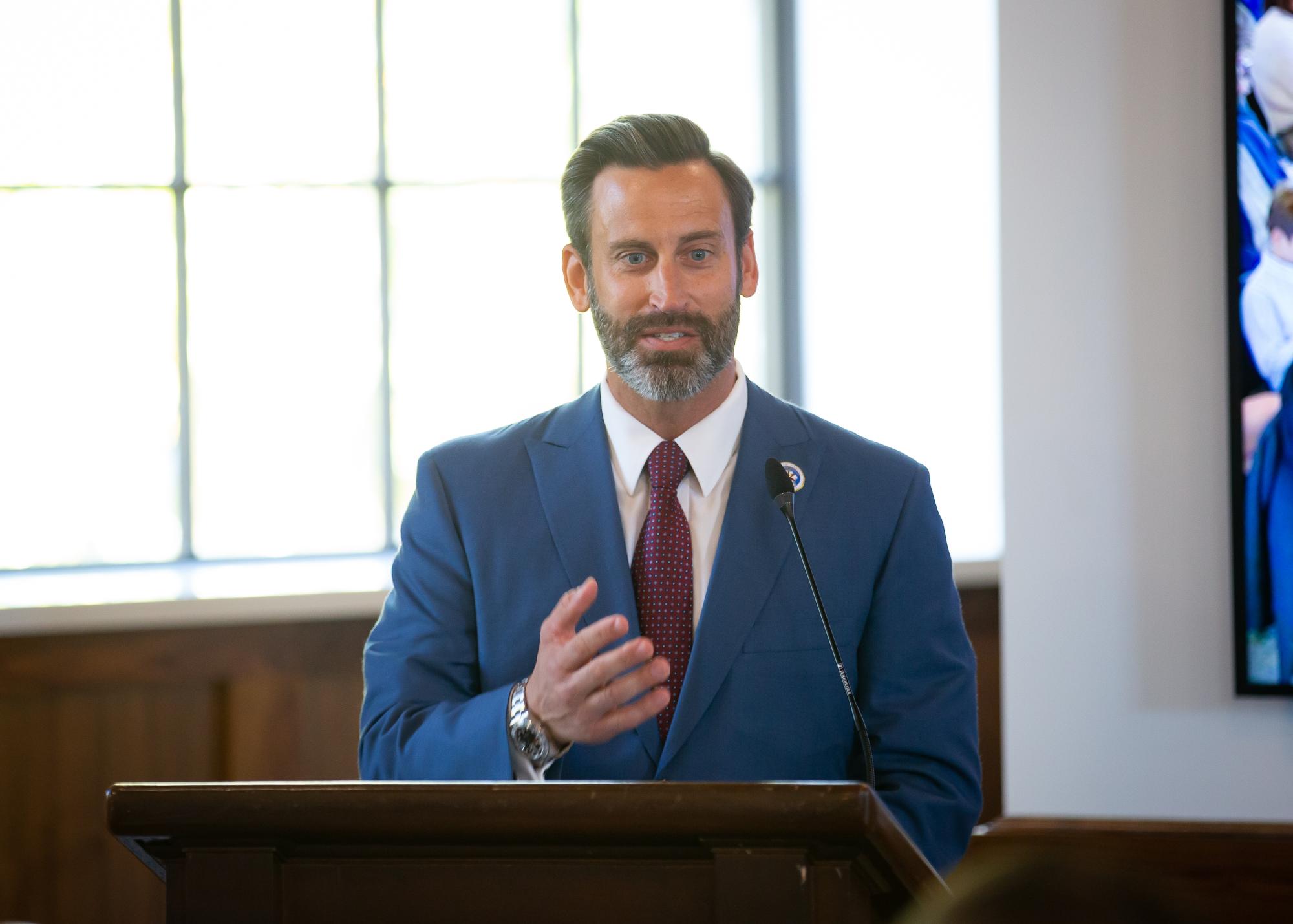 Mayor Josh Gates at podium