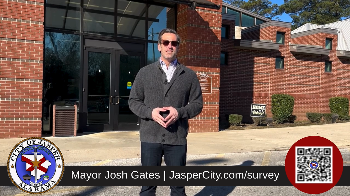 Mayor Gates in front of Memorial Park Natatorium
