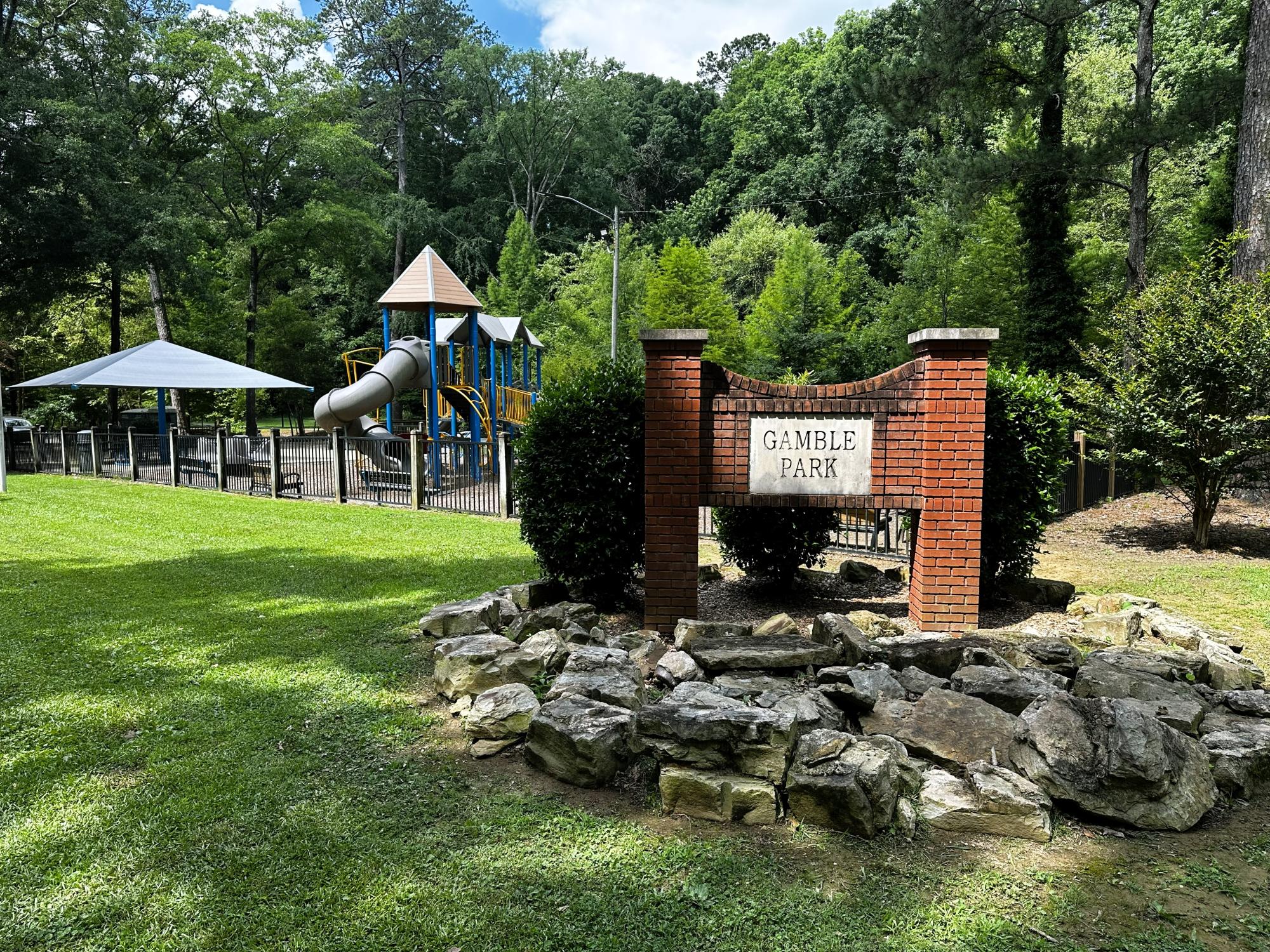 Gamble Park sign with playground in background