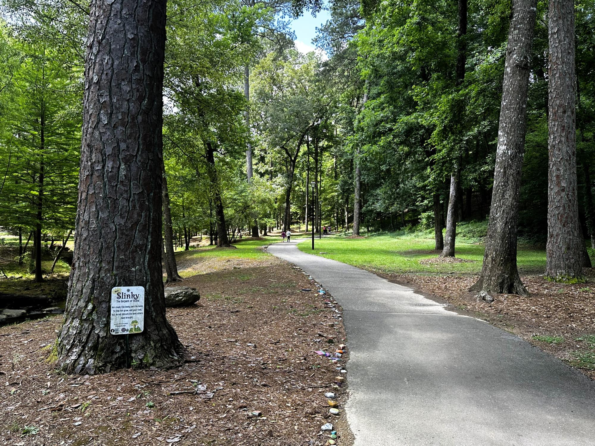 Gamble Park walking path with Slinky sign